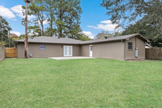 back of house featuring french doors, a yard, and a patio area