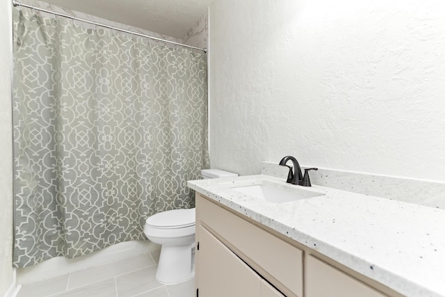 bathroom with curtained shower, tile patterned floors, a textured ceiling, toilet, and vanity