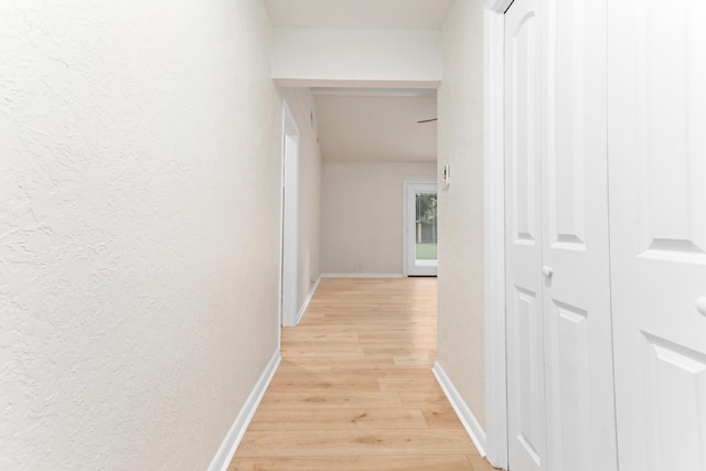 hall with light hardwood / wood-style flooring