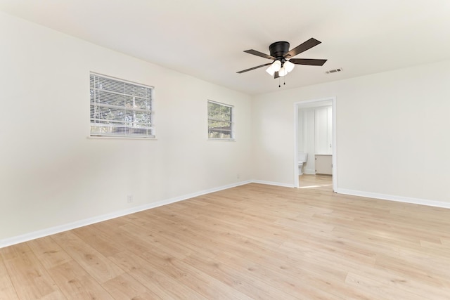 spare room featuring ceiling fan and light hardwood / wood-style flooring