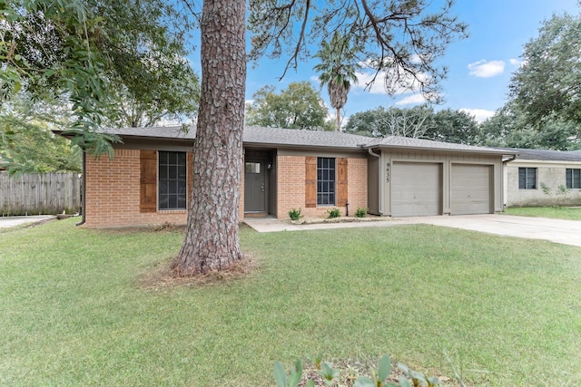 ranch-style home featuring a front yard and a garage