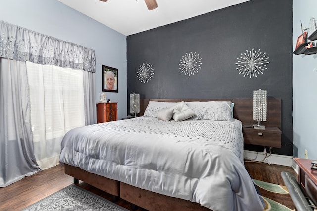 bedroom featuring hardwood / wood-style floors and ceiling fan