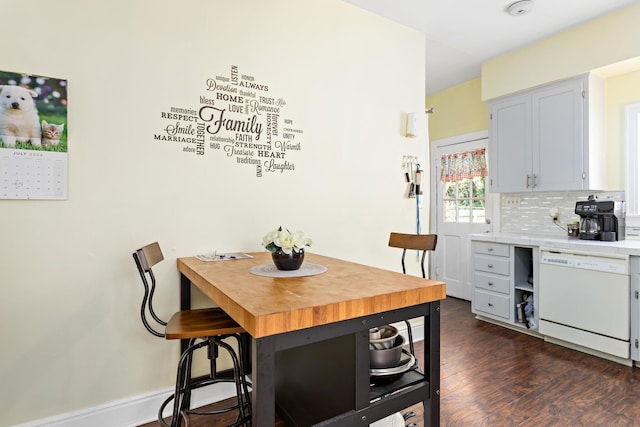 dining space featuring dark hardwood / wood-style floors