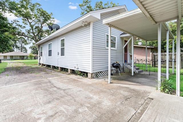 exterior space with a carport