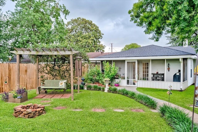 3821 Suncrest Dr, Groves, TX 77619 - back of property featuring a sunroom, roof with shingles, and a pergola