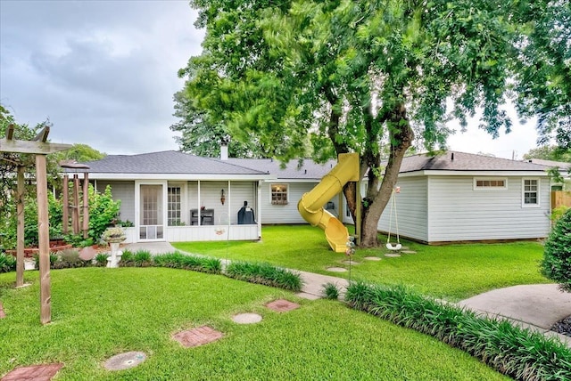 3821 Suncrest Dr, Groves, TX 77619 - rear view of property with a sunroom and a yard