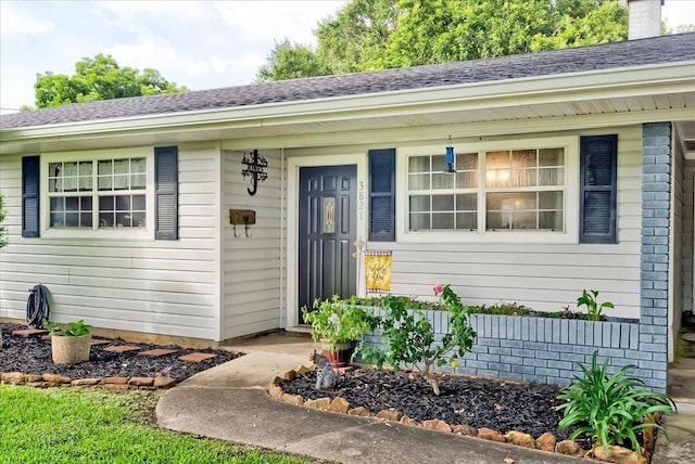 3821 Suncrest Dr, Groves, TX 77619 - property entrance featuring roof with shingles and a porch