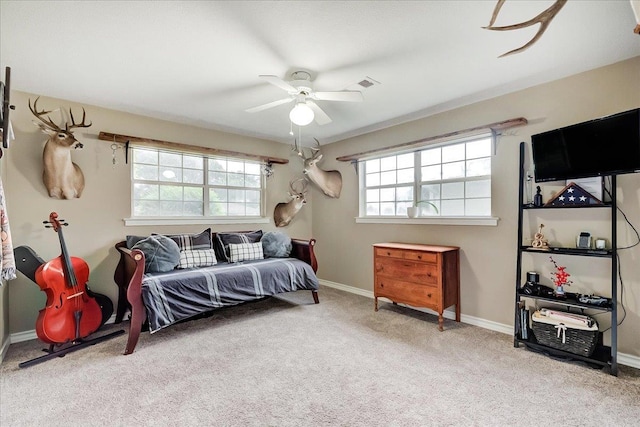 3821 Suncrest Dr, Groves, TX 77619 - carpeted bedroom with baseboards and a ceiling fan