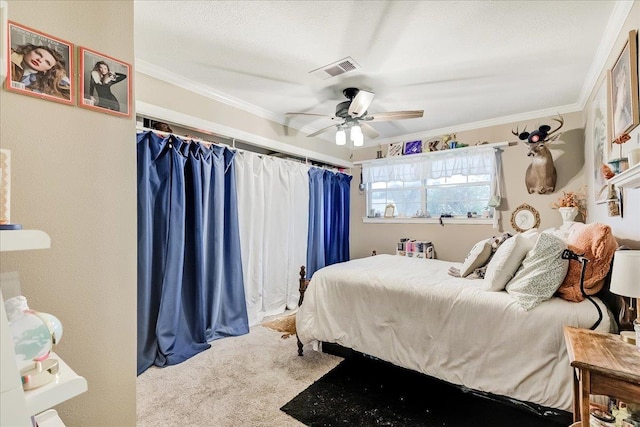 3821 Suncrest Dr, Groves, TX 77619 - bedroom featuring crown molding, carpet floors, ceiling fan, and a textured ceiling