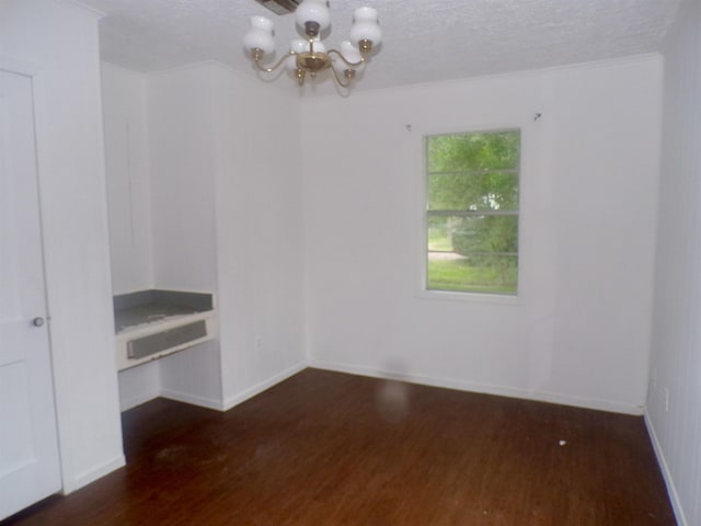 468 Garland Ave, Beaumont, TX 77705 - unfurnished room featuring a chandelier, wood finished floors, baseboards, and a textured ceiling