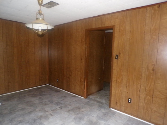 468 Garland Ave, Beaumont, TX 77705 - unfurnished room featuring wooden walls and tile patterned floors