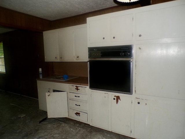 468 Garland Ave, Beaumont, TX 77705 - kitchen featuring oven, white cabinetry, and electric stovetop