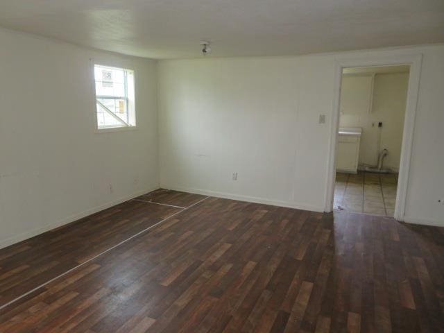 unfurnished room featuring dark hardwood / wood-style floors