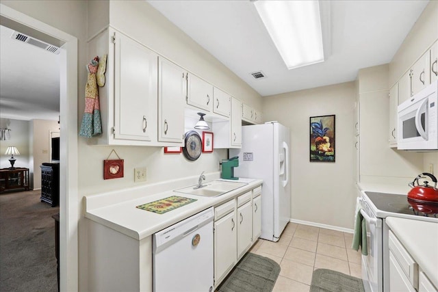 1006 Park Meadow Dr, Beaumont, TX 77706 - kitchen with white appliances, white cabinets, and light countertops