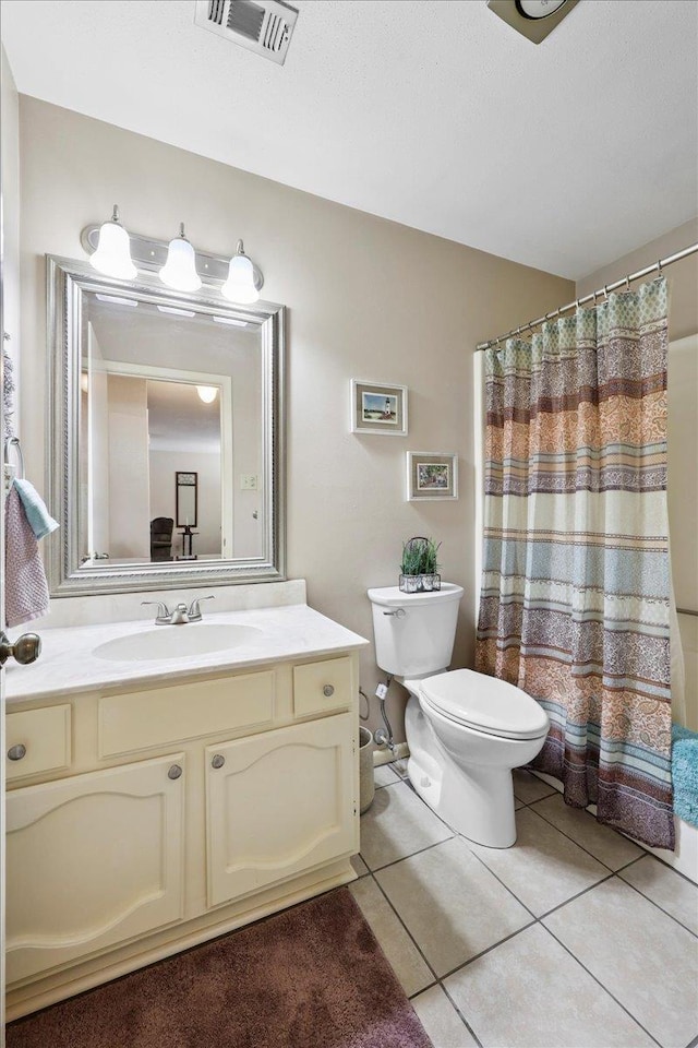 1006 Park Meadow Dr, Beaumont, TX 77706 - full bathroom featuring vanity, tile patterned floors, and curtained shower