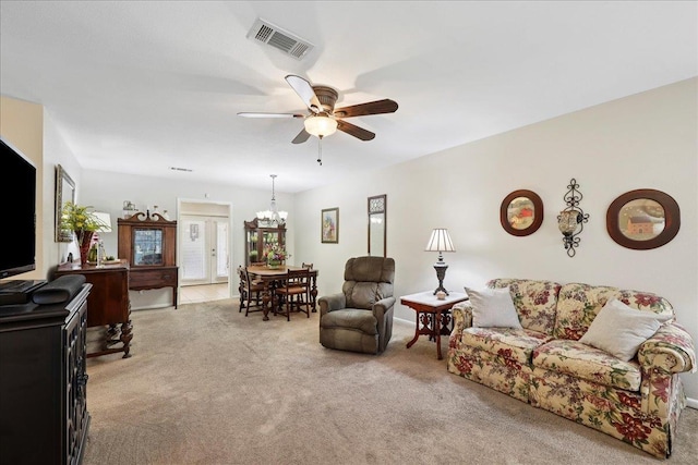 1006 Park Meadow Dr, Beaumont, TX 77706 - living room with light colored carpet, ceiling fan, and a chandelier