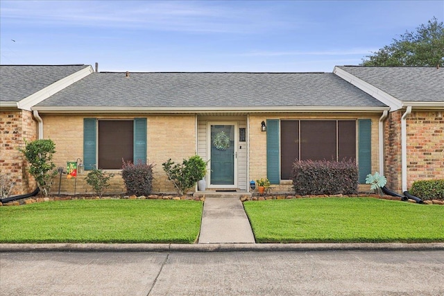 1006 Park Meadow Dr, Beaumont, TX 77706 - ranch-style house with a shingled roof, a front lawn, and brick siding