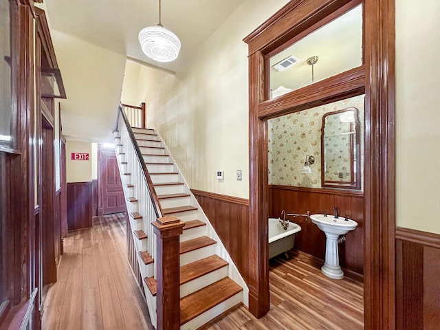 stairs with hardwood / wood-style floors