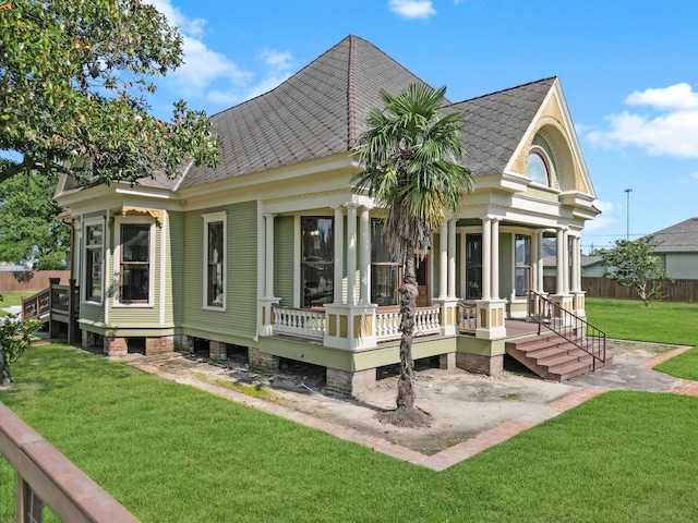 back of house featuring a lawn