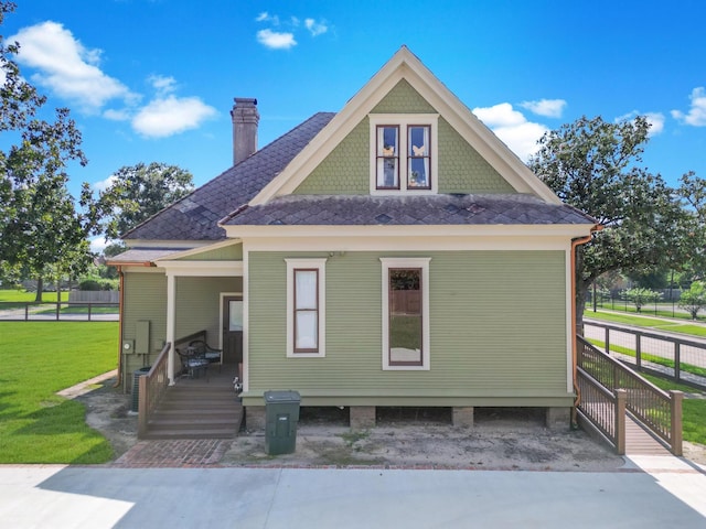 view of front of house with a front lawn and a porch