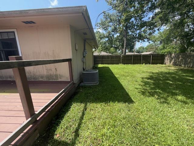 290 Rosine St, Beaumont, TX 77707 - fenced backyard with a wooden deck
