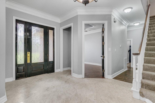 foyer with crown molding and hardwood / wood-style flooring