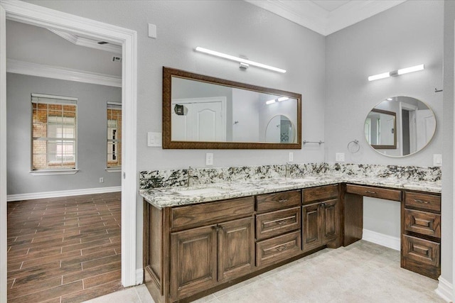 bathroom with vanity and ornamental molding