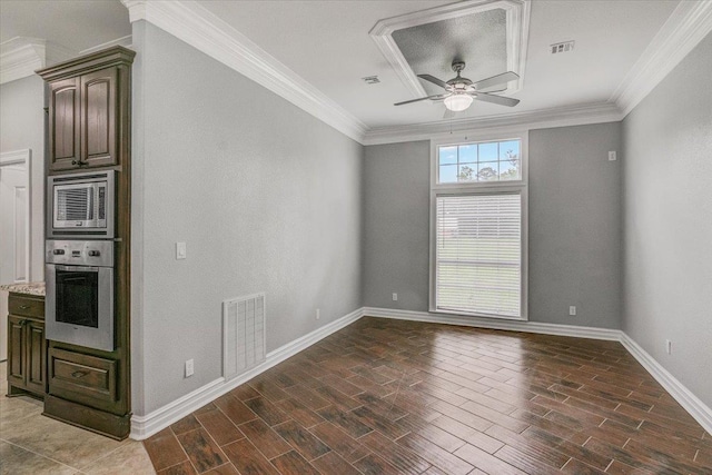 interior space with light stone countertops, appliances with stainless steel finishes, ceiling fan, and ornamental molding