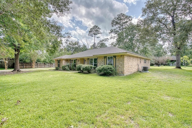 246 Pinevale Way, Sour Lake, TX 77659 - view of front facade featuring central AC unit and brick siding