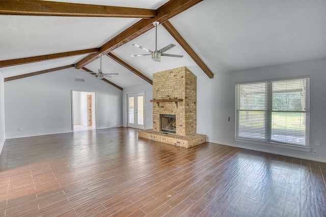 246 Pinevale Way, Sour Lake, TX 77659 - unfurnished living room with ceiling fan, wood finished floors, a fireplace, and baseboards