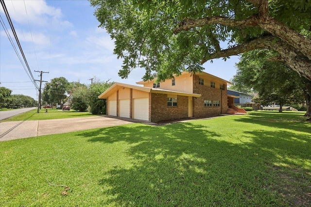2701 Mcbride Dr, Port Neches, TX 77651 - view of side of home with a lawn, brick siding, and an attached garage