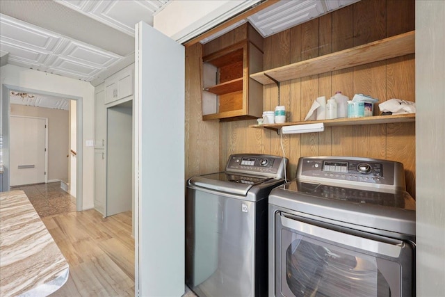 2701 Mcbride Dr, Port Neches, TX 77651 - washroom featuring washing machine and dryer and light wood-type flooring