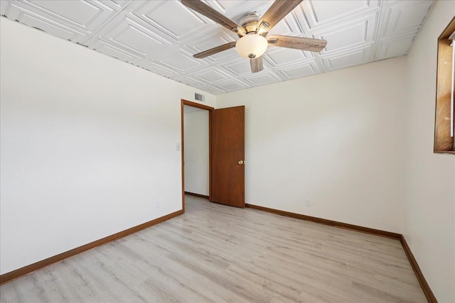 2701 Mcbride Dr, Port Neches, TX 77651 - unfurnished room featuring an ornate ceiling, a ceiling fan, and light wood-style floors