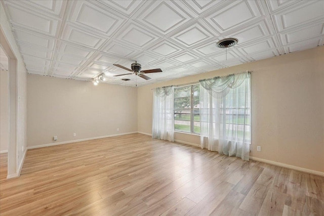 2701 Mcbride Dr, Port Neches, TX 77651 - spare room with ceiling fan, light wood-style flooring, and an ornate ceiling