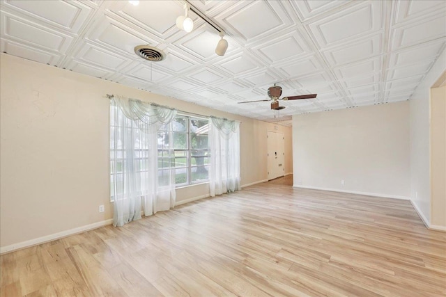 2701 Mcbride Dr, Port Neches, TX 77651 - spare room featuring light wood-style floors, a ceiling fan, and an ornate ceiling