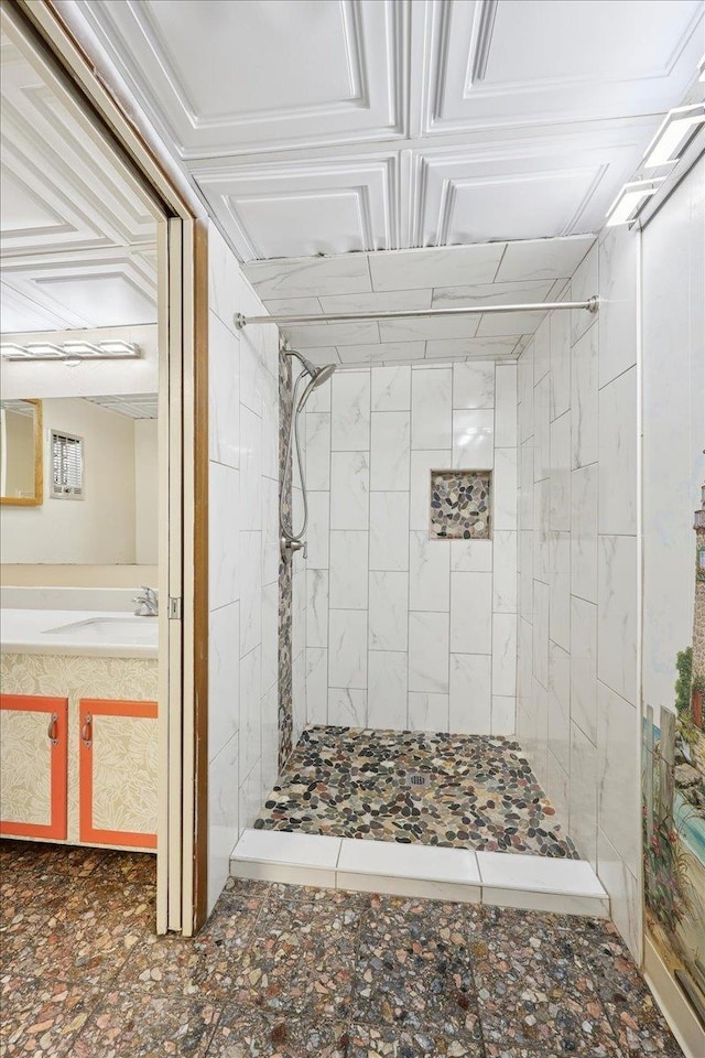 2701 Mcbride Dr, Port Neches, TX 77651 - bathroom featuring a tile shower and vanity