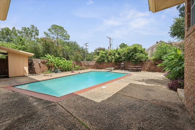 2701 Mcbride Dr, Port Neches, TX 77651 - view of pool with a patio area, a fenced backyard, and a diving board
