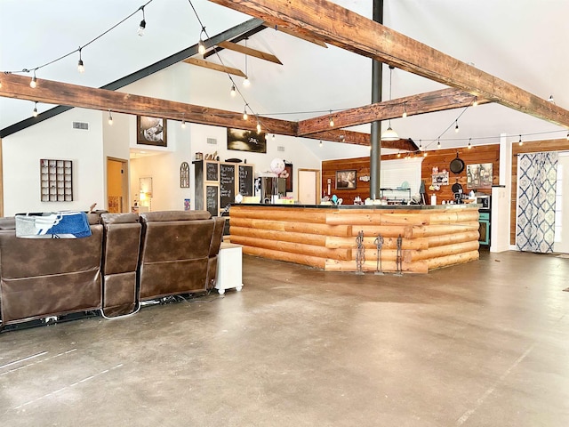 living area featuring beamed ceiling, finished concrete flooring, visible vents, and high vaulted ceiling