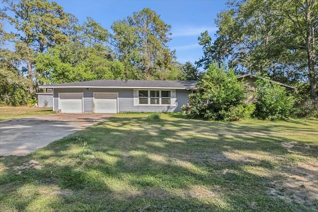 view of front of home featuring a garage and a front lawn