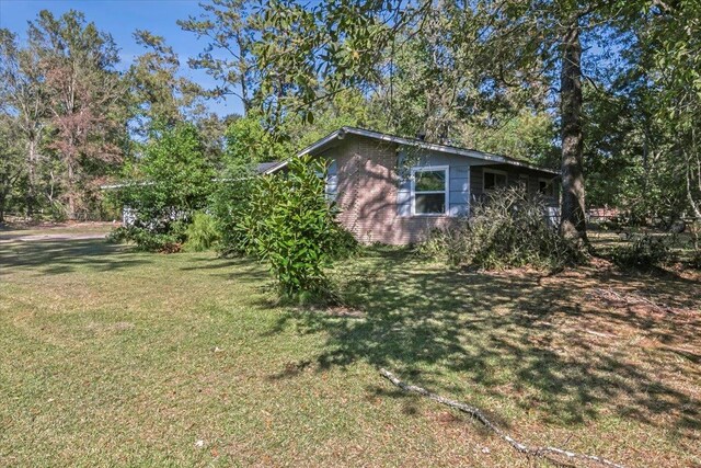 view of home's exterior with a lawn