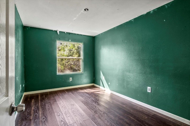 empty room with wood-type flooring