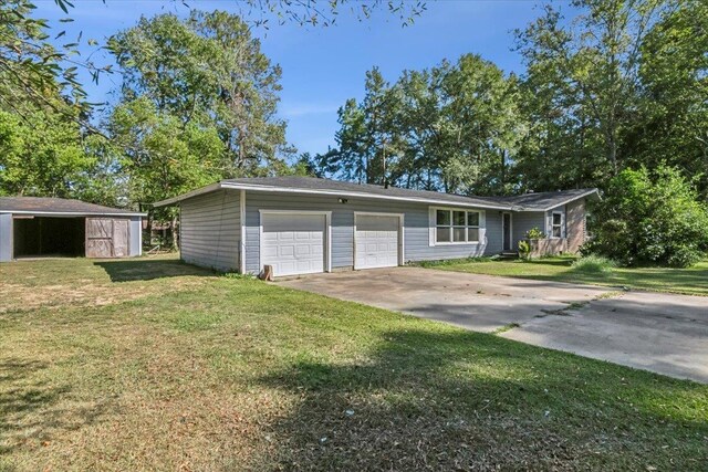 ranch-style house featuring a front yard and a garage