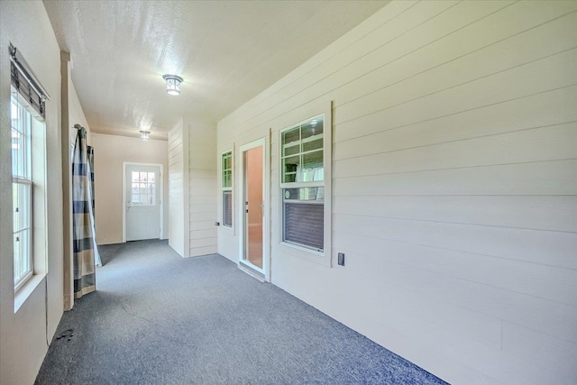 unfurnished sunroom with plenty of natural light