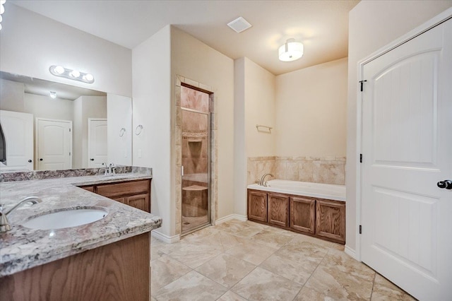 bathroom with vanity and separate shower and tub