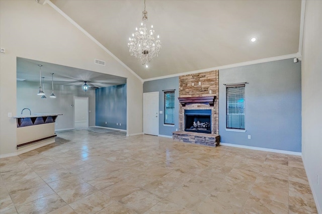 unfurnished living room featuring ceiling fan with notable chandelier, crown molding, a fireplace, and high vaulted ceiling