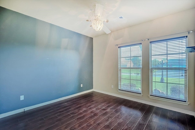 spare room featuring ceiling fan and dark hardwood / wood-style flooring