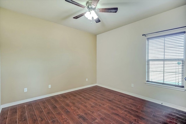 empty room featuring dark hardwood / wood-style floors, a healthy amount of sunlight, and ceiling fan