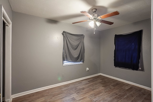 spare room featuring ceiling fan and hardwood / wood-style floors