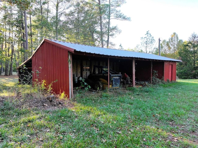 view of outdoor structure with a lawn