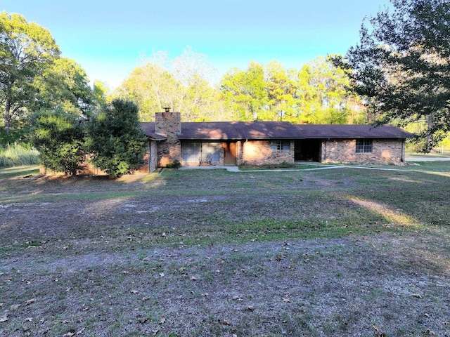 ranch-style house with a front lawn